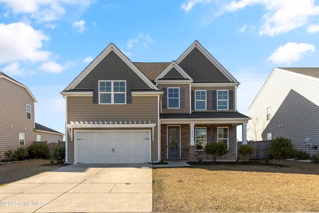 craftsman-style house with a garage, fence, a front lawn, and concrete driveway