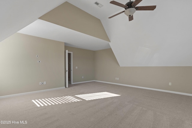 additional living space featuring carpet flooring, visible vents, and baseboards