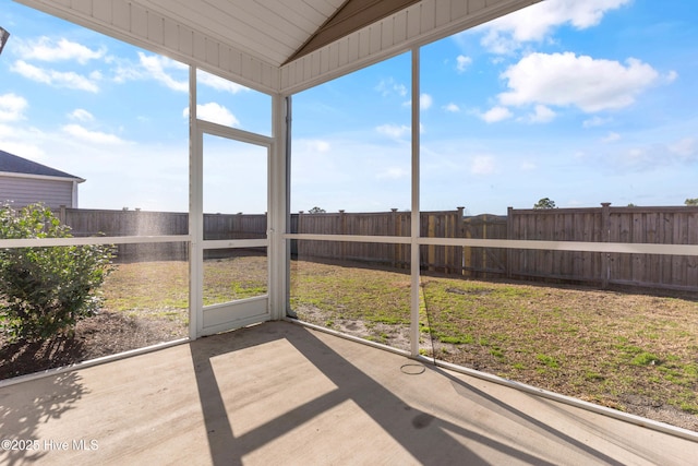 unfurnished sunroom with vaulted ceiling