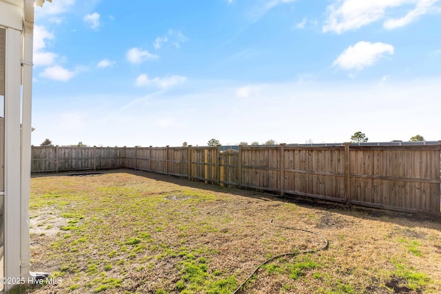 view of yard with a fenced backyard