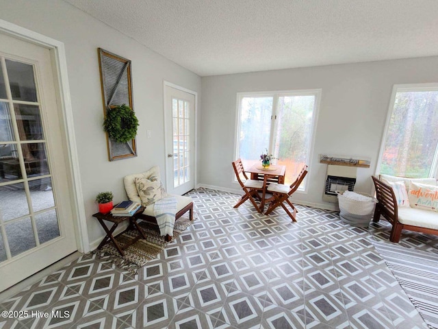 sitting room with a wealth of natural light and a textured ceiling