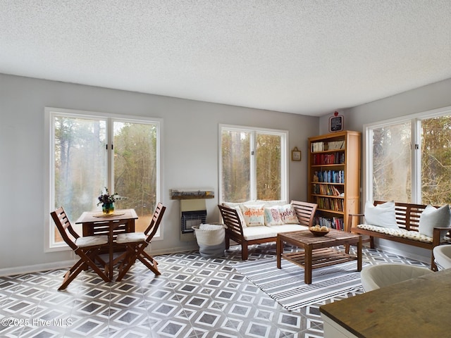 living room featuring a textured ceiling and a wealth of natural light