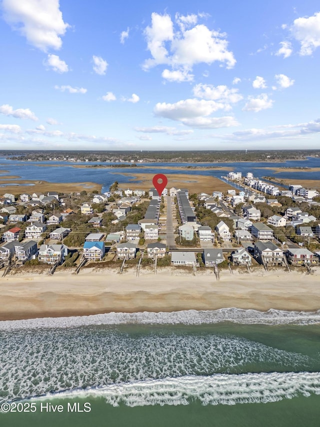 aerial view featuring a water view and a view of the beach