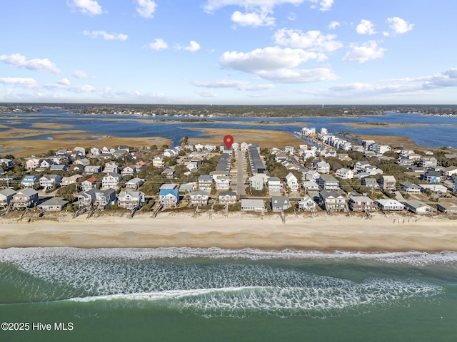 drone / aerial view with a view of the beach and a water view