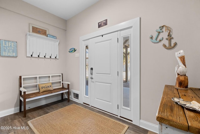 entryway with dark wood-type flooring