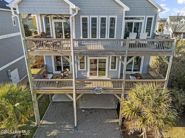 rear view of property with a balcony