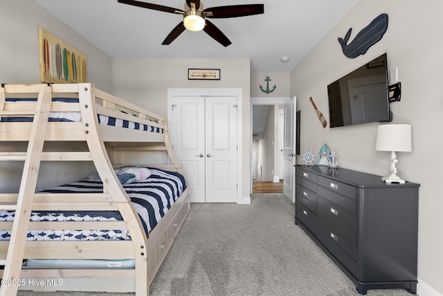 bedroom with carpet floors, a closet, and ceiling fan