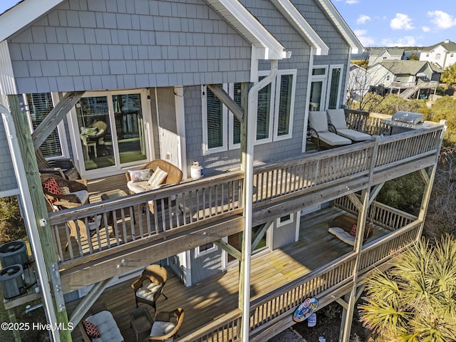 back of property featuring a wooden deck