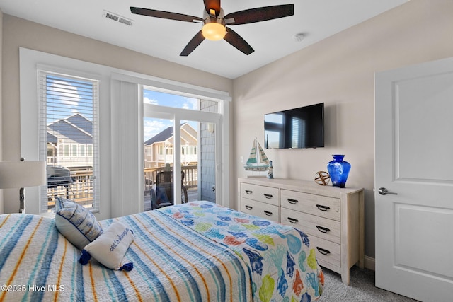 carpeted bedroom featuring ceiling fan and access to outside