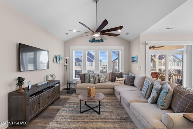 living room featuring dark hardwood / wood-style flooring, vaulted ceiling, and ceiling fan