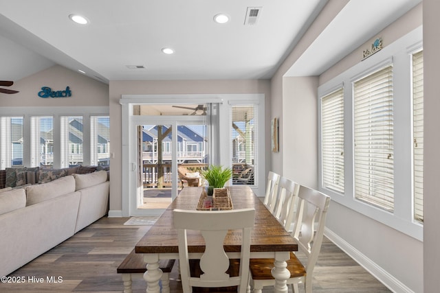 dining space featuring a healthy amount of sunlight, hardwood / wood-style flooring, vaulted ceiling, and ceiling fan