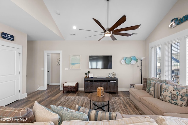 living room with ceiling fan, dark hardwood / wood-style flooring, and vaulted ceiling