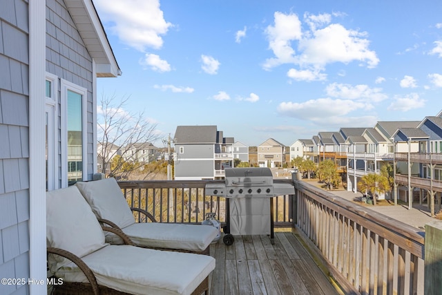 wooden terrace featuring grilling area