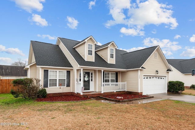 cape cod home featuring a garage, a front lawn, and a porch