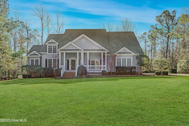 view of front facade featuring a front yard and a sunroom