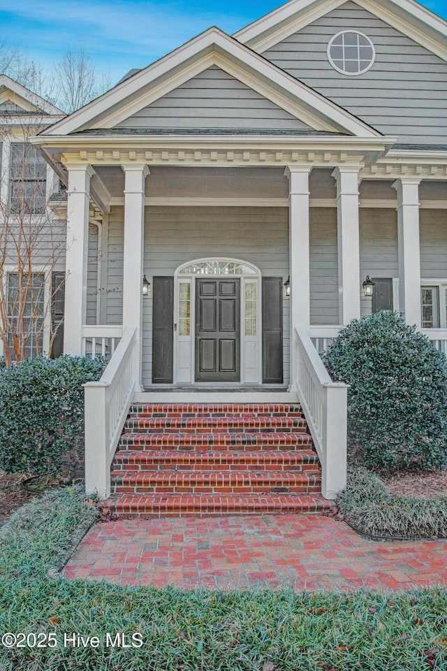 doorway to property with a porch