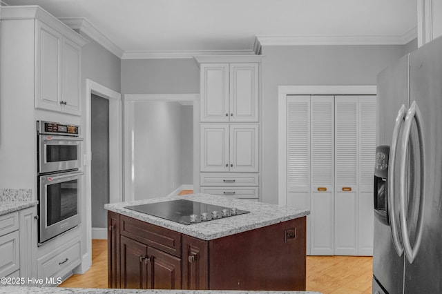 kitchen featuring white cabinetry, dark brown cabinets, and stainless steel appliances