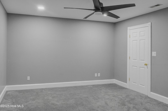 spare room with ceiling fan and carpet floors