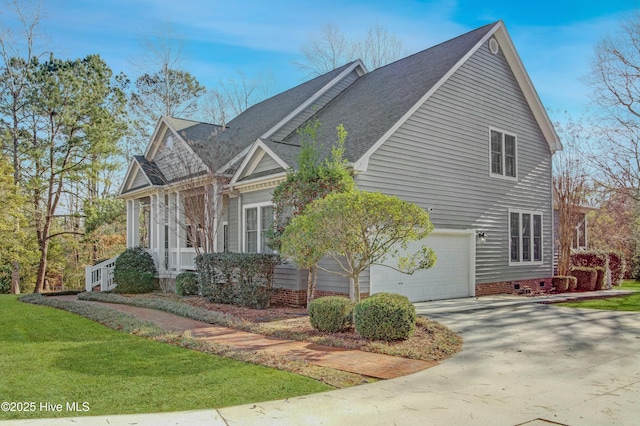 view of side of home with a garage