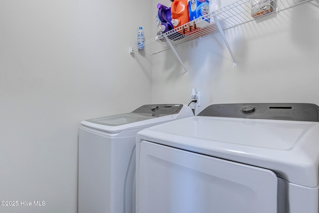 washroom featuring washer and clothes dryer