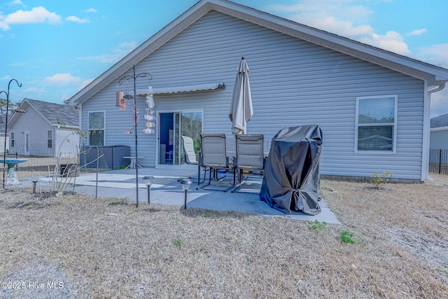 rear view of property featuring a patio area