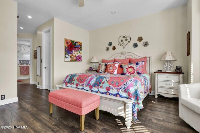 bedroom with dark hardwood / wood-style flooring and ceiling fan