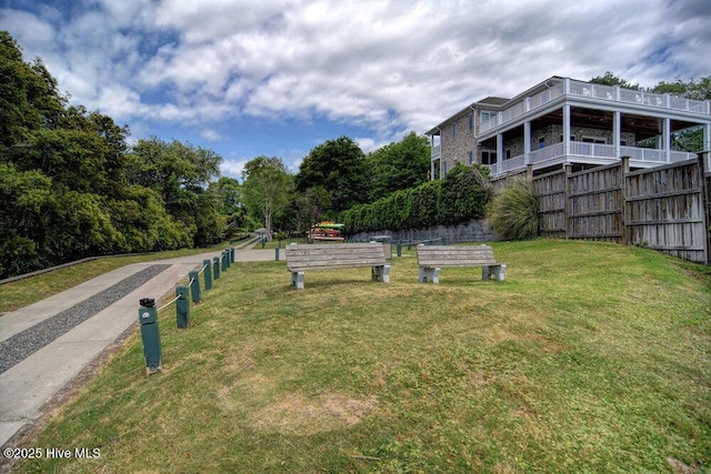 exterior space with fence and a yard