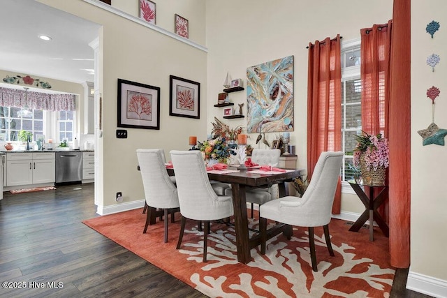 dining space featuring recessed lighting, baseboards, and dark wood-style floors