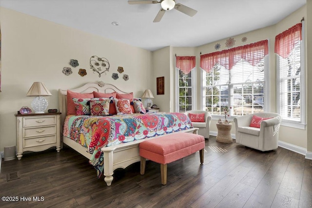 bedroom featuring dark wood-style flooring, baseboards, and ceiling fan