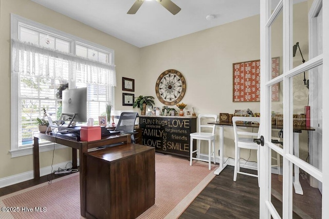 home office with baseboards, ceiling fan, and wood finished floors