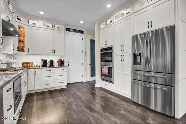 kitchen with ventilation hood, stainless steel appliances, dark wood finished floors, and white cabinetry