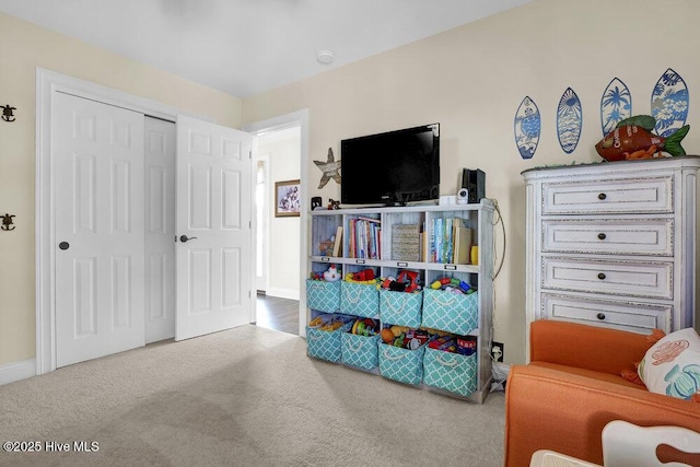 playroom with baseboards and carpet flooring
