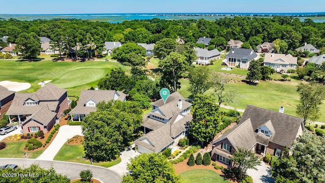 birds eye view of property featuring a residential view, a water view, and golf course view