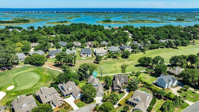drone / aerial view featuring a residential view, a water view, and golf course view