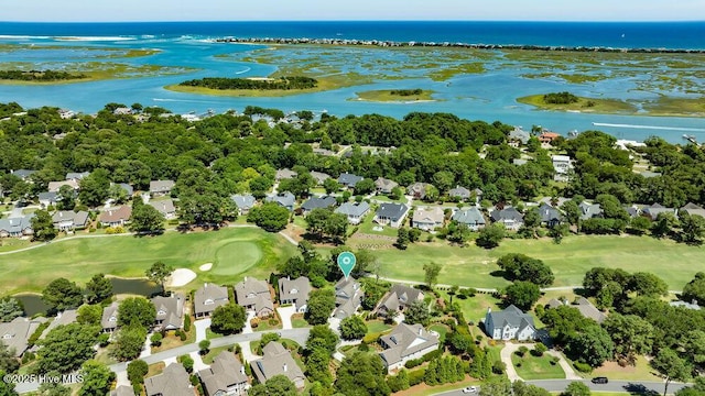 birds eye view of property with a water view, a residential view, and golf course view