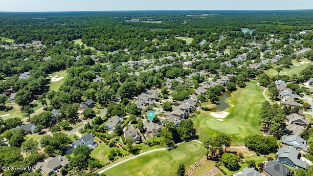 bird's eye view featuring a residential view, view of golf course, and a wooded view