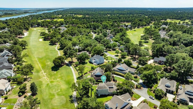 bird's eye view with a wooded view, golf course view, and a residential view