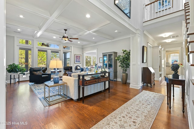 living room with visible vents, coffered ceiling, a ceiling fan, and decorative columns