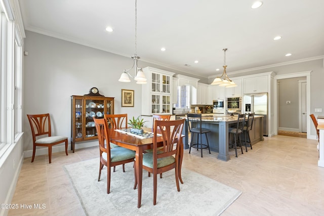 dining area featuring recessed lighting, crown molding, and baseboards