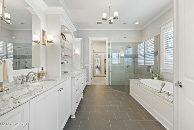 full bath featuring ceiling fan with notable chandelier, a tile shower, crown molding, a bath, and vanity