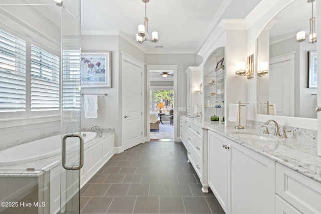 ensuite bathroom with vanity, crown molding, a bath, ceiling fan with notable chandelier, and connected bathroom