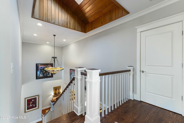 stairway with crown molding, wood ceiling, recessed lighting, and wood finished floors