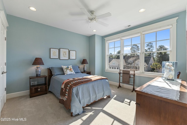 carpeted bedroom featuring recessed lighting and baseboards