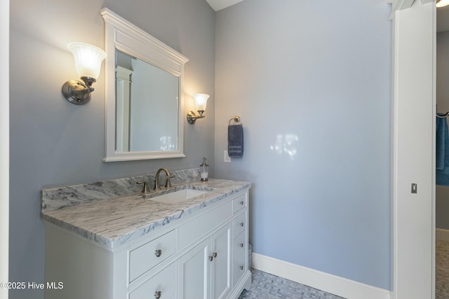 bathroom with baseboards and vanity