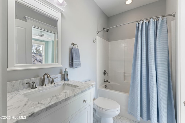 full bathroom with vanity, toilet, and shower / tub combo