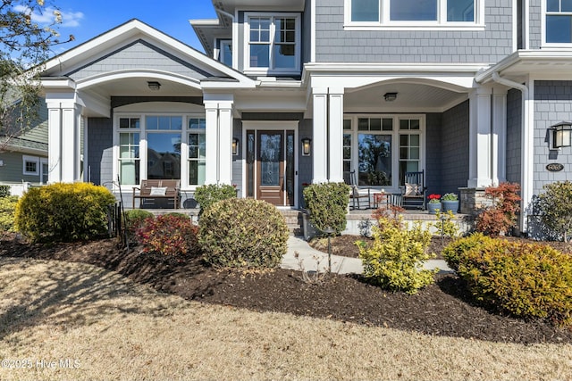 doorway to property featuring covered porch