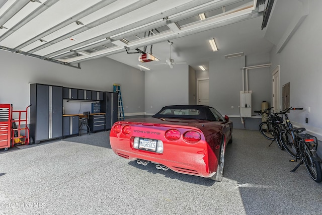 garage with a garage door opener and visible vents