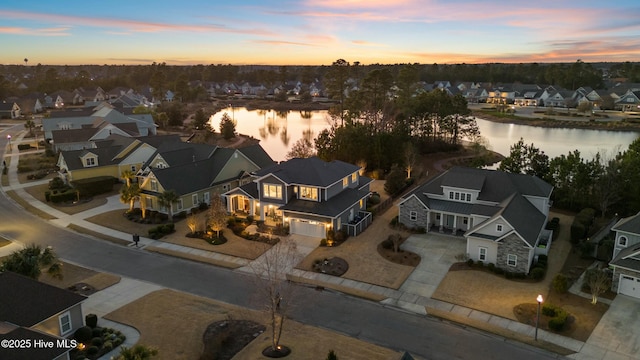 aerial view featuring a residential view and a water view