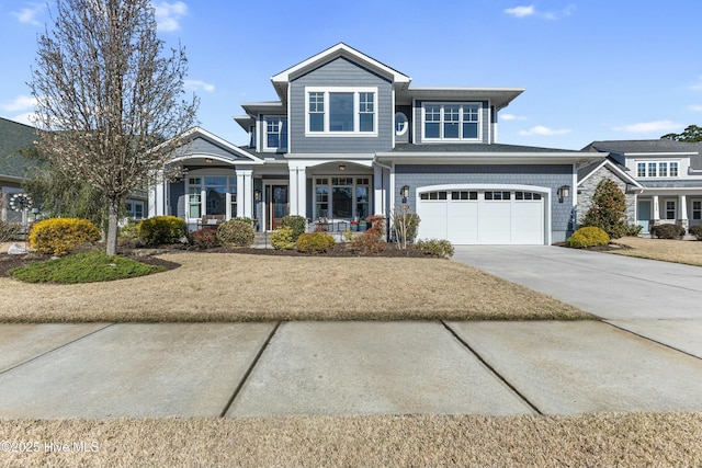 view of front of home with a garage and driveway