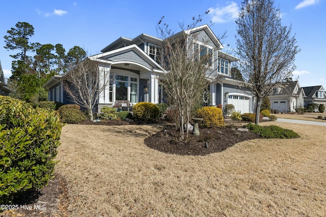 shingle-style home featuring a garage